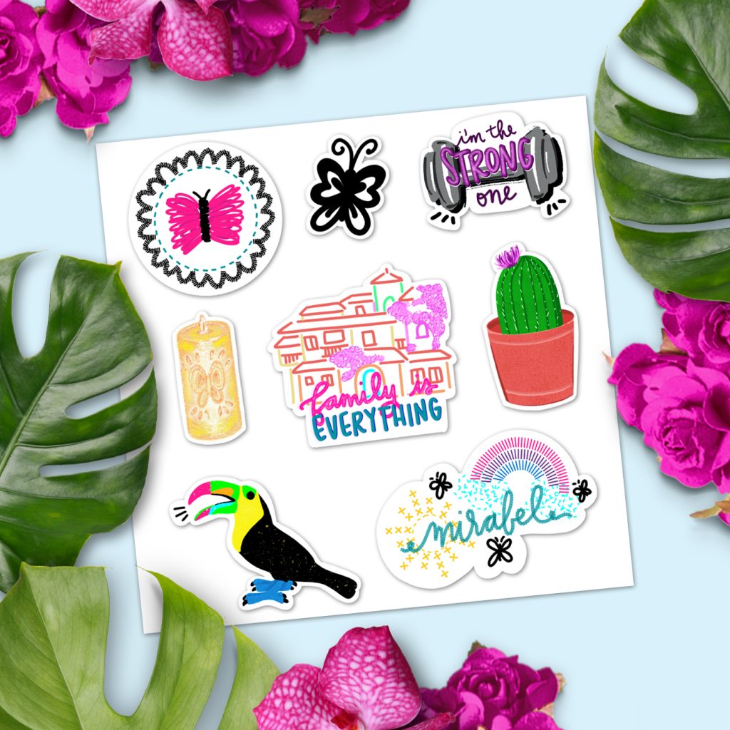 printable encanto stickers on notecard with tropical leaves and flowers.